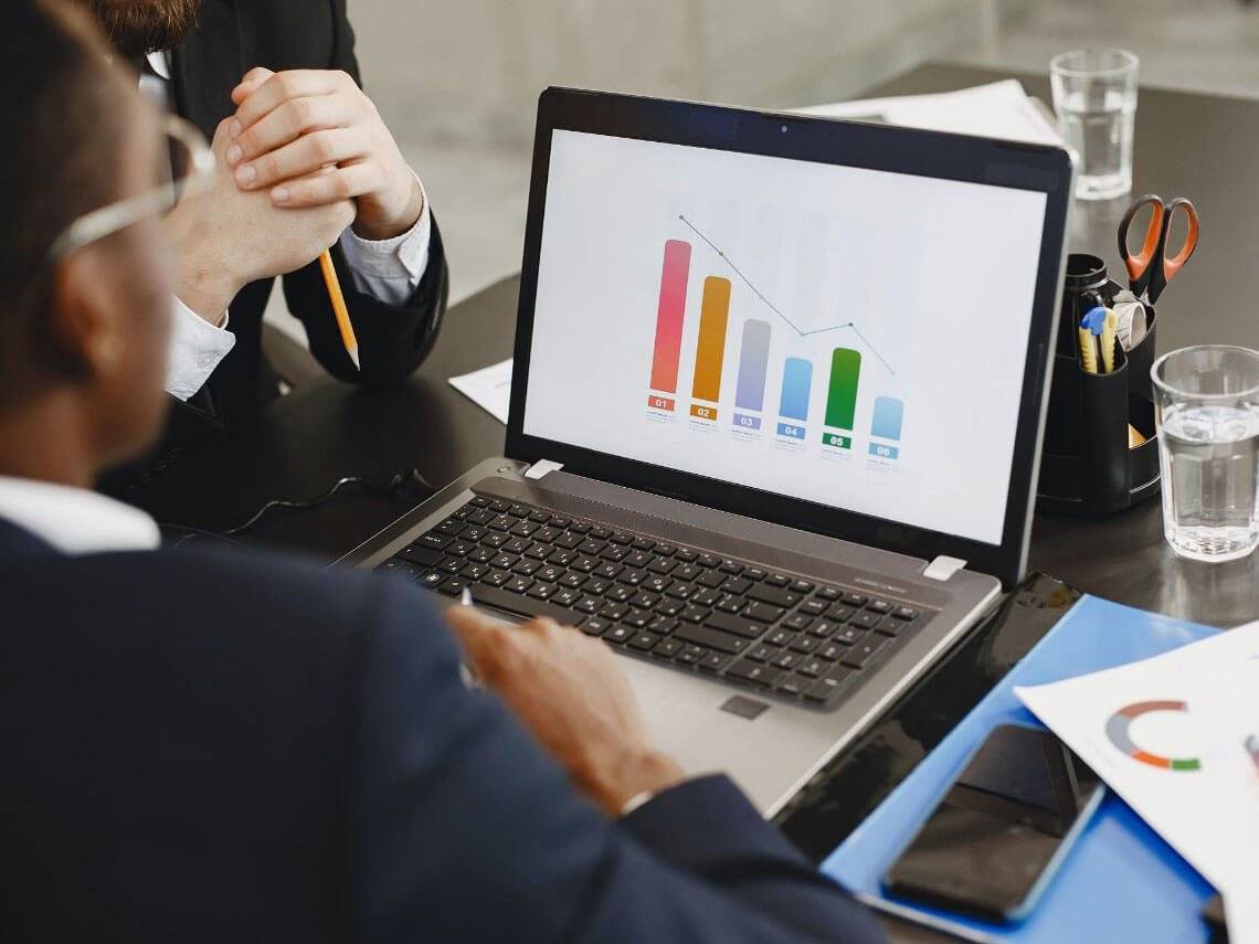 Computer screen with PowerPoint presentation of companies in Serbia.