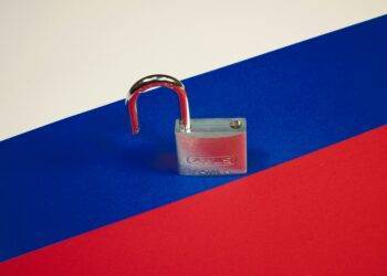 Russian flag with opened padlock, money transfer from Serbia to Russia